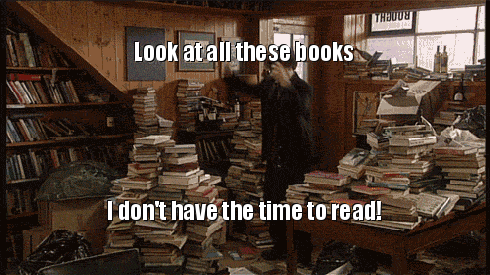 GIF of man spinning in a room full of books